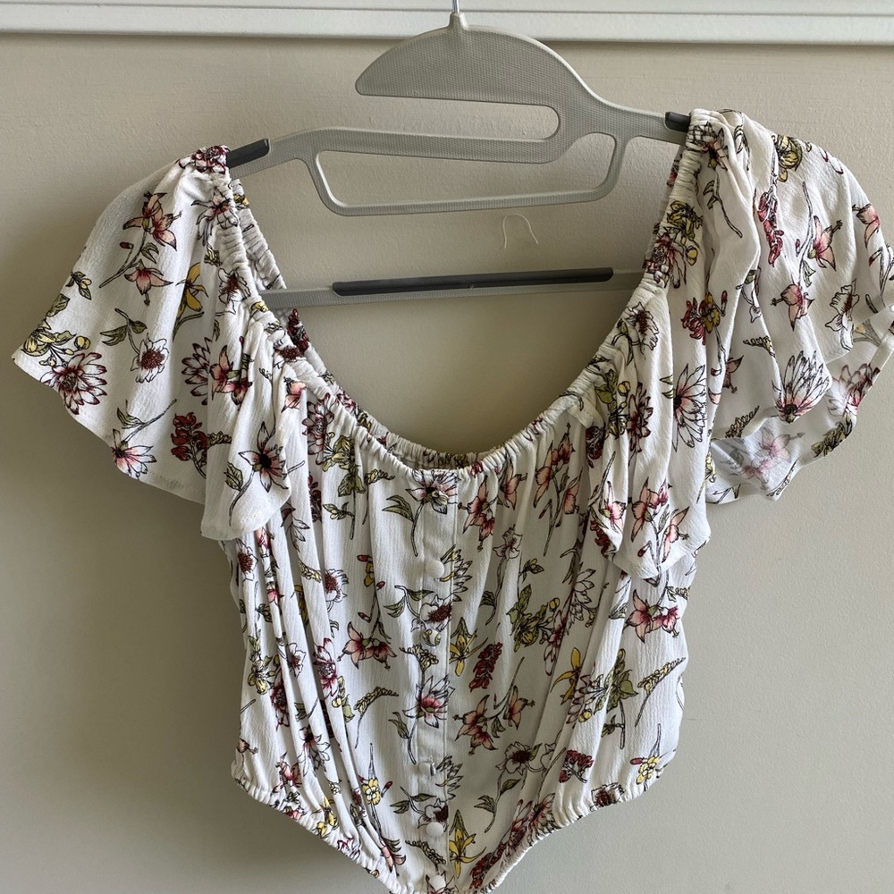 Target off shoulder crop top with buttons.
